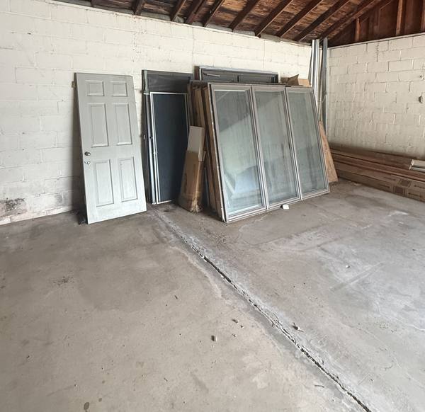 Garage full of old doors and windows