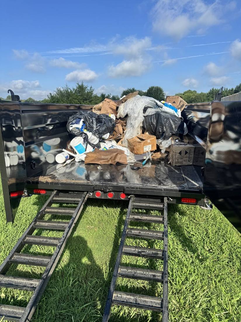 Trailer loaded with bagged household junk